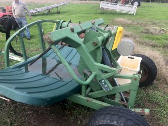 Hustler Hay bale feed out cart