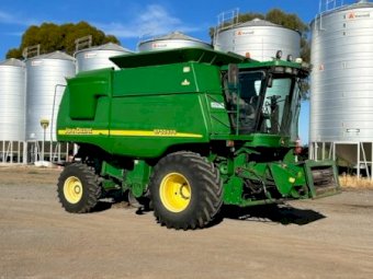 2002 John Deere 9750 STS header with 936D front and trailer.