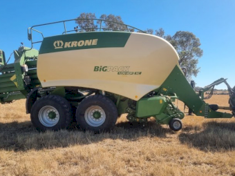 2015 John Deere 8295R Tractor with a 2017 Krone 1290 HDP 11 XC Big Pack Baler