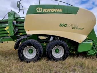 2015 John Deere 8295R Tractor with a 2017 Krone 1290 HDP 11 XC Big Pack Baler