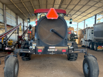 Case IH WD 2303 Windrower with HoneyBee Front and Trailer