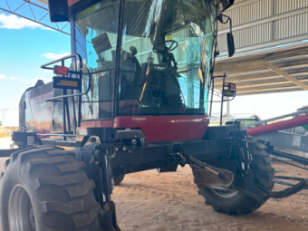 Case IH WD 2303 Windrower with HoneyBee Front and Trailer