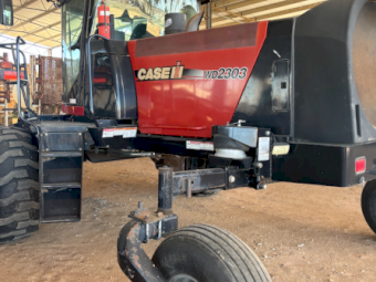 Case IH WD 2303 Windrower with HoneyBee Front and Trailer