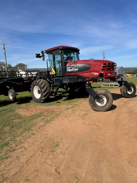 2011 MacDon 150 Windrower with 35ft 2018 D65 Front