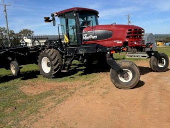 2011 MacDon 150 Windrower with 35ft 2018 D65 Front
