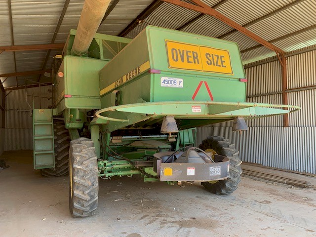 John Deere 8820 Hydrostatic Header. 34ft comb on trailer.