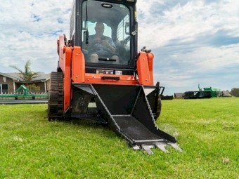 SKID STEER STUMP BUCKET TREE REMOVER.