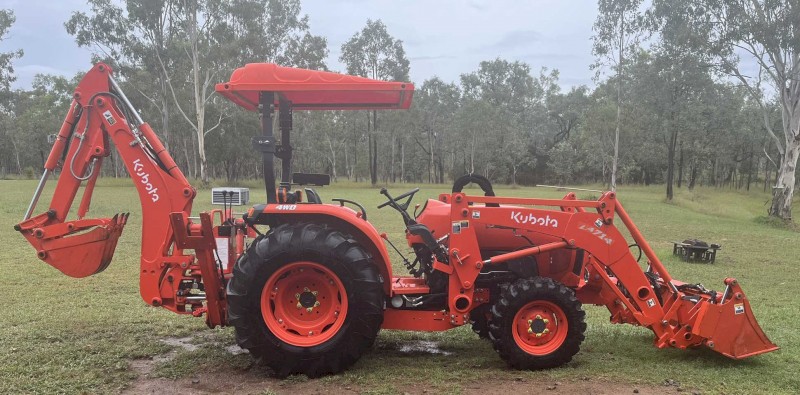 Kubota L4600 4WD Ultimate Package including 4 in 1 bucket, backhoe with hydro thumb, slasher, post driver, shade hood and pallet forks