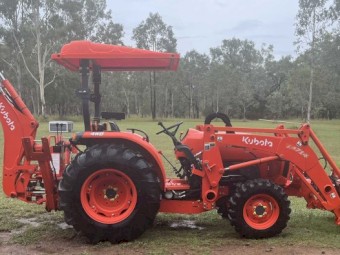 Kubota L4600 4WD Ultimate Package including 4 in 1 bucket, backhoe with hydro thumb, slasher, post driver, shade hood and pallet forks