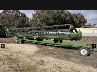 2012 John Deere 640D Front with x-auger and trailer
