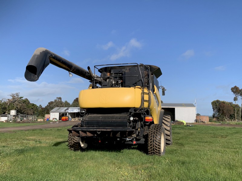 New Holland CR970 with 94C front on Leith trailer 