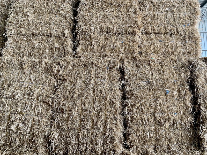 Barley straw header tailings in Bale Baron packs 
